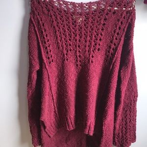 A maroon sweater